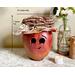 This is a fall apple decoration. It is a real gourd with a happy face  carved into it. This gourd is named Mac and  measures 7 x 8.5 inches.